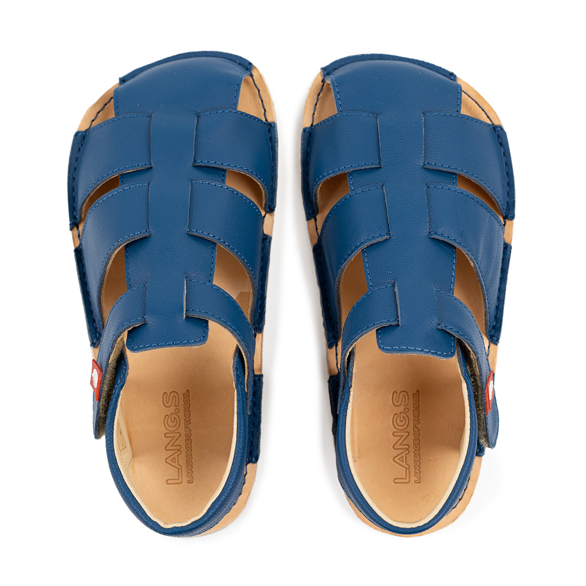 Tikki Lasta Leather Mare sandals set for børn med blå læderoverdel i vævet mønster og lys indersål, giver en barfodsfølelse.