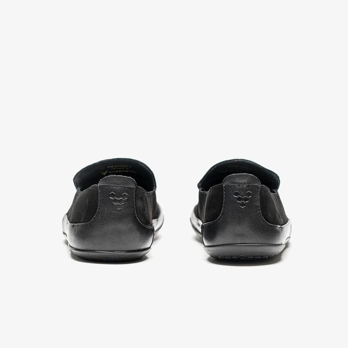 Sorte hælkapper med Vivobarefoot-symbol set bagfra