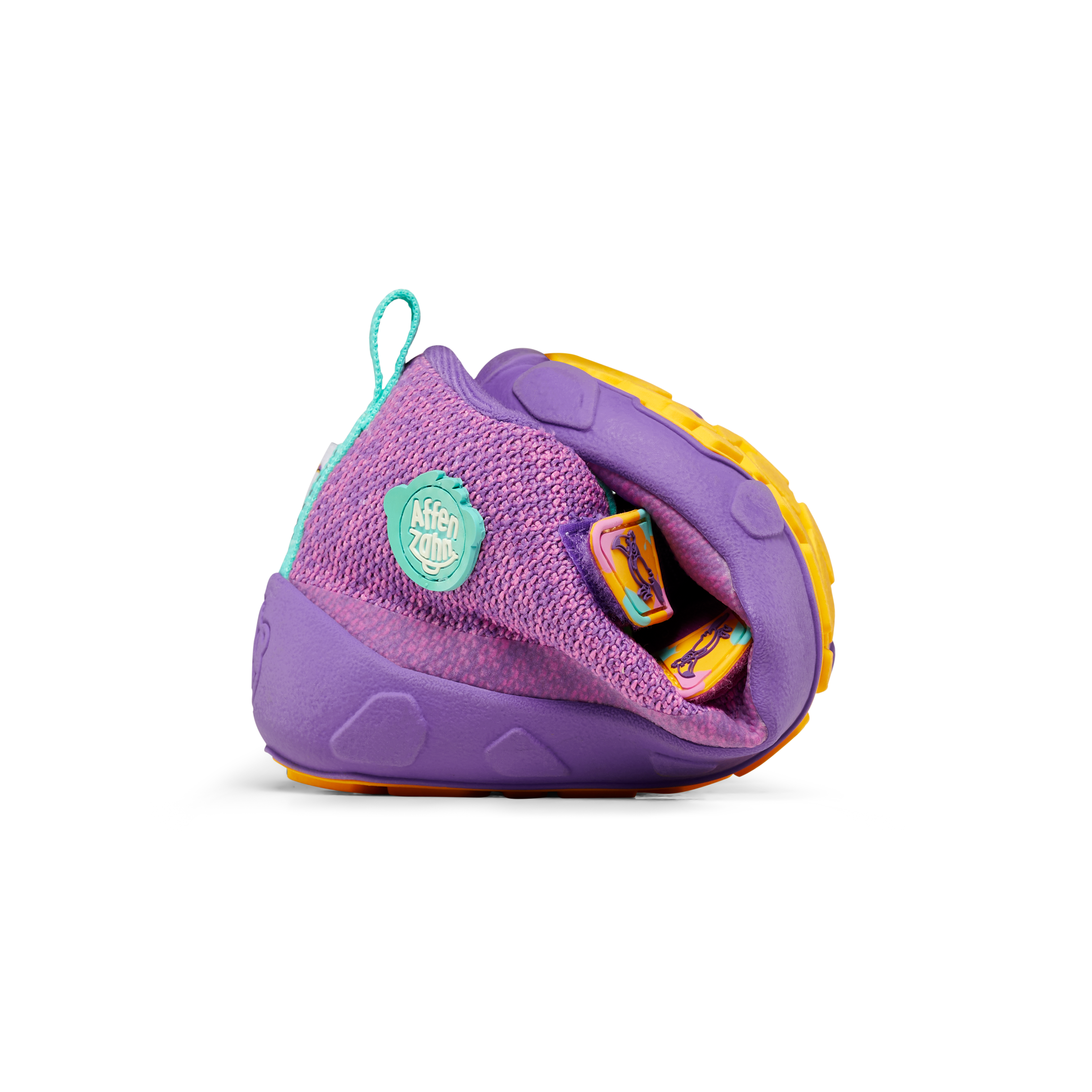 Affenzahn Lowboot Knit Happy Creative Toucan for kids in purple and yellow, rolled to emphasize flexibility and barefoot style.