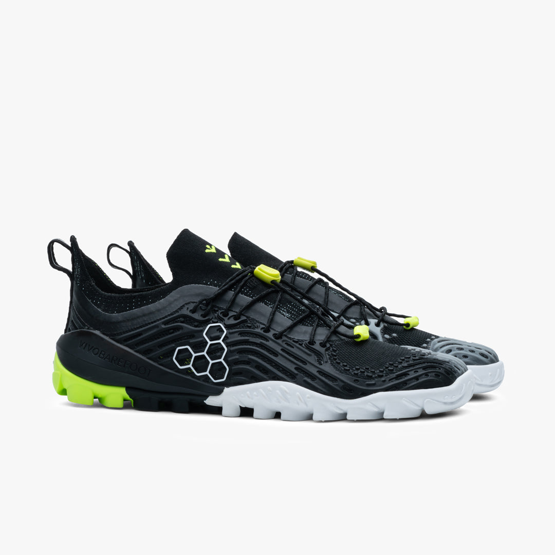 Vivobarefoot Hydra ESC Womens barefoot sko i Obsidian / Safety Yellow. Sort med sikkerhedsgule detaljer, holdbar Michelin-ydersål, designet til amphibiske aktiviteter.